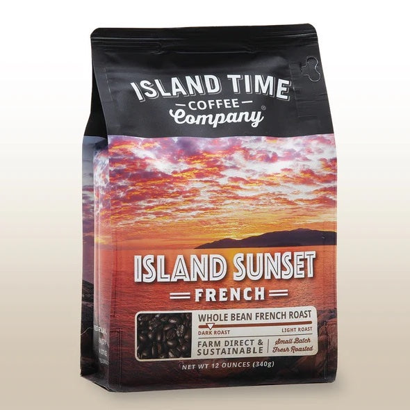 A bag of 'Island Sunset' French roast coffee beans from Island Time Coffee Company, featuring a picture of a sunset over a body of water.