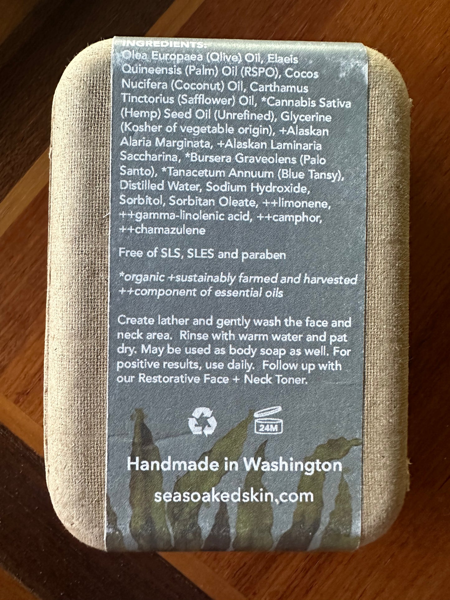 The back of the cardboard product box, listing the ingredients and instructions for use, along with "Handmade in Washington" "seasoakedskin.com"