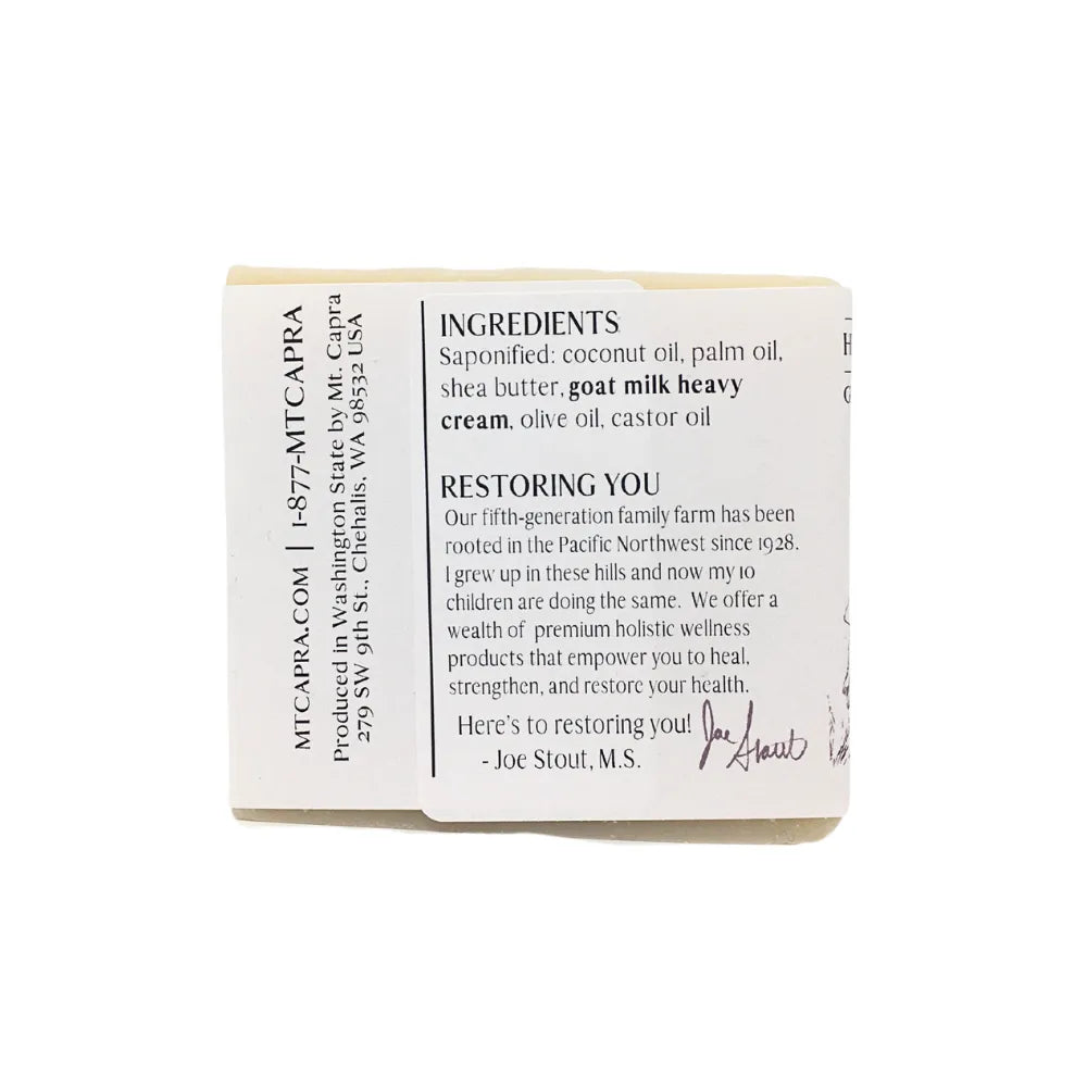 Back of soap bar. Label lists ingredients, and information about the company