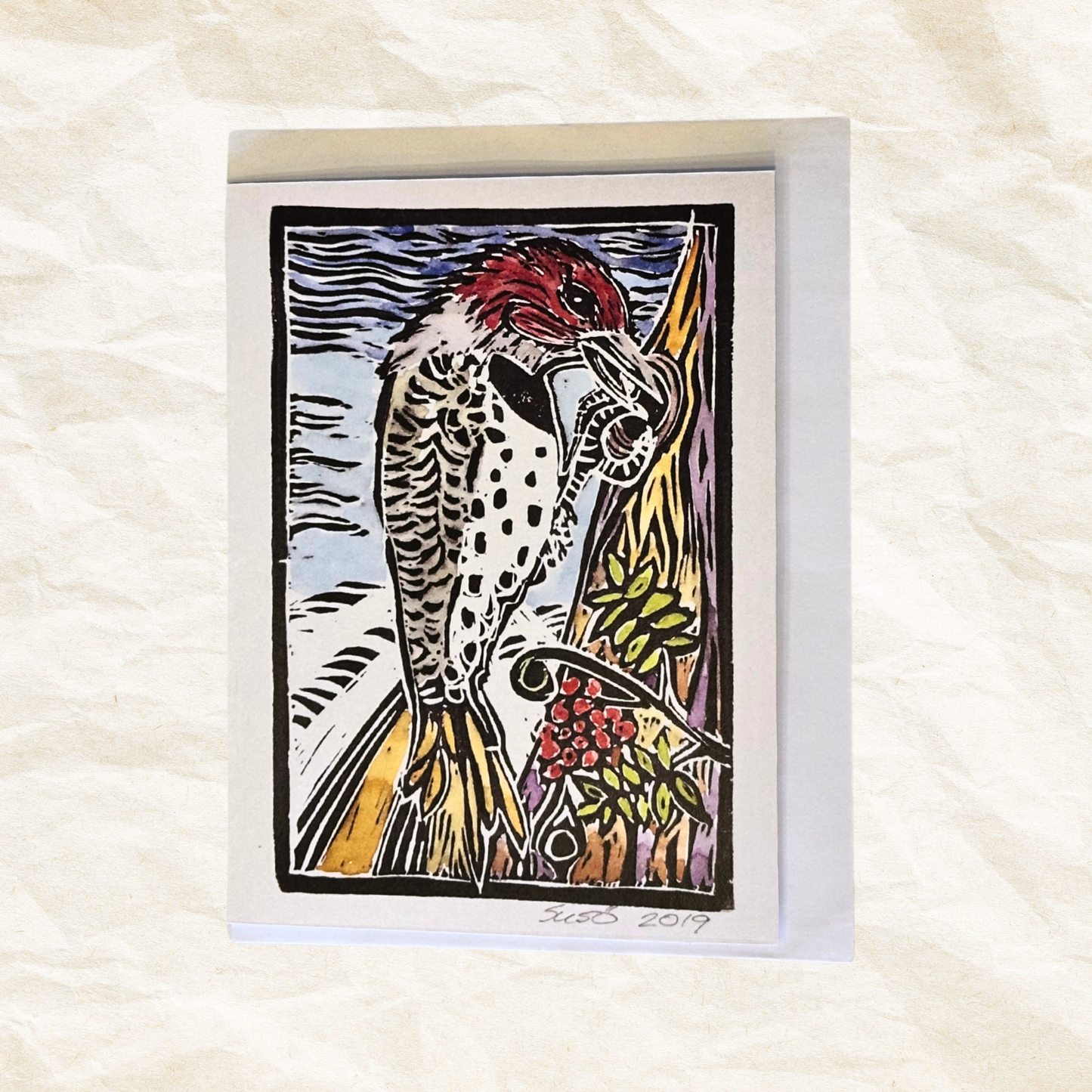 Card with a stylized illustration of a bird on a white background
