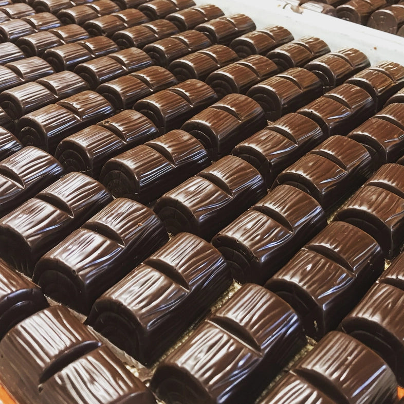 Rows of dark brown chocolate bars