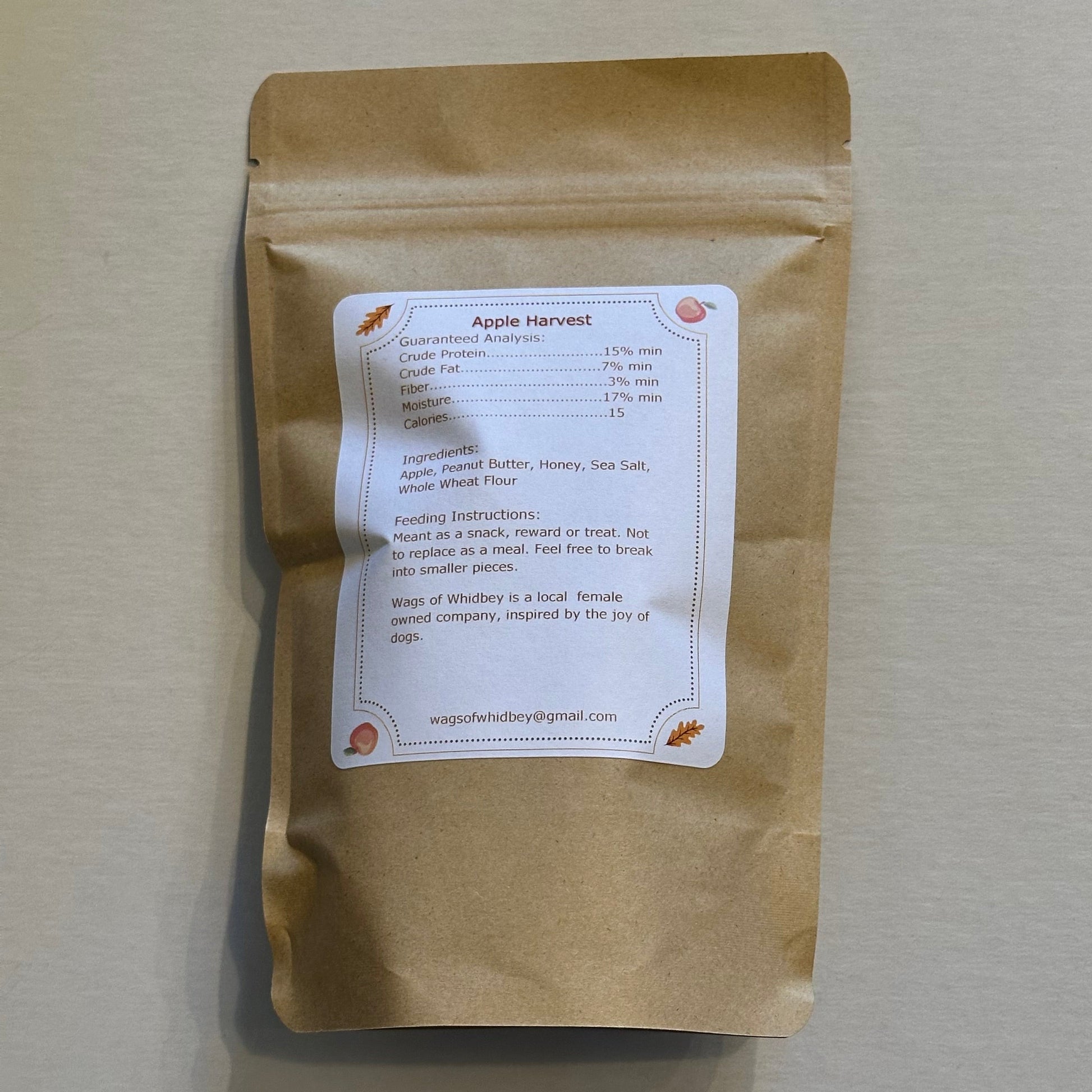 Kraft paper package with a label on a white surface