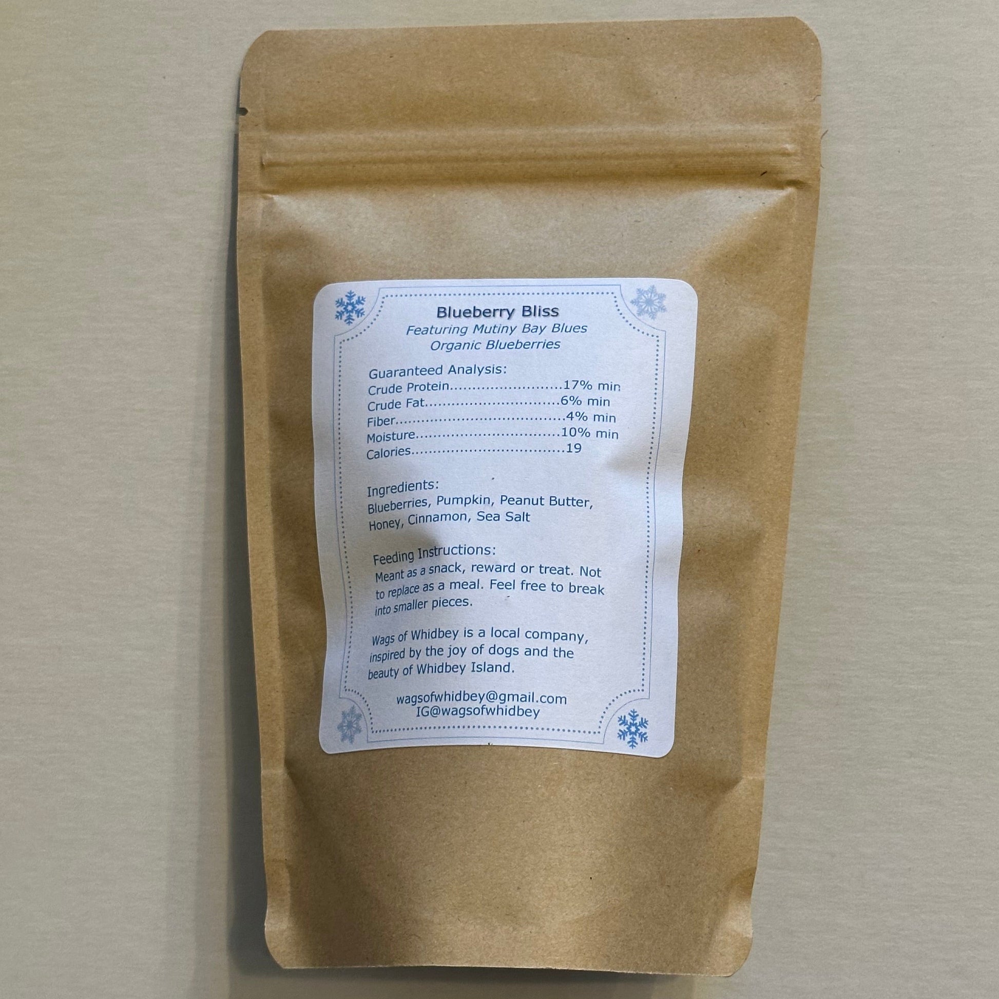 Kraft paper package with a label on a beige surface