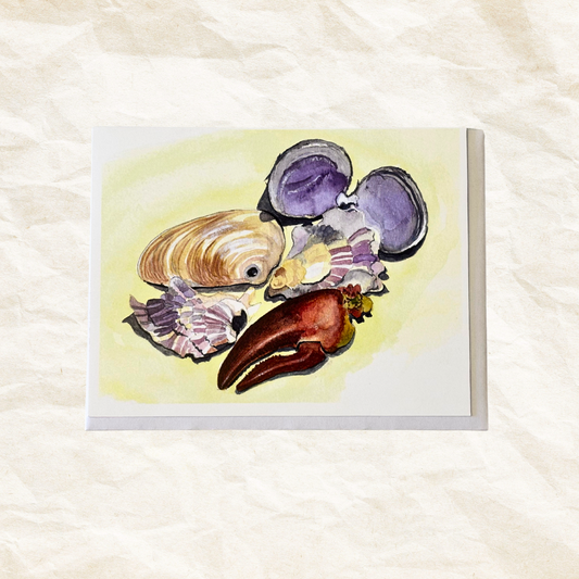 Card with illustrations of seashells and a lobster claw on a textured white background