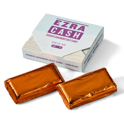 Box of Ezra Cash candy with two orange foiled wrapped candies