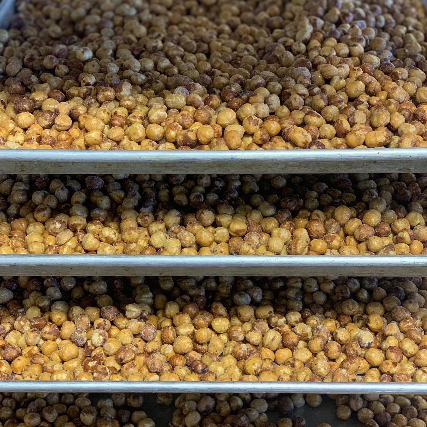 Baking trays full of roasted hazelnuts