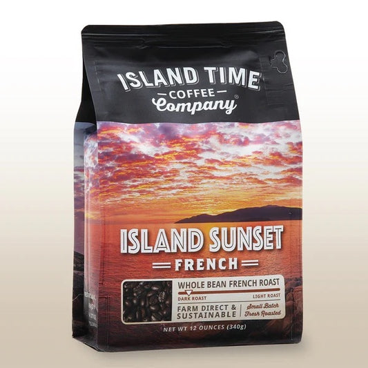 A bag of 'Island Sunset' French roast coffee beans from Island Time Coffee Company, featuring a picture of a sunset over a body of water.