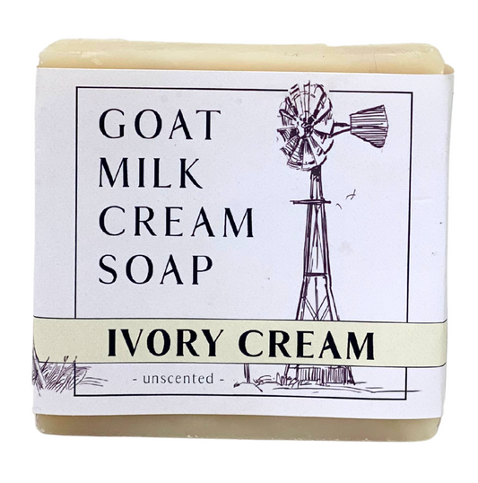 Bar of goat milk cream soap with a windmill illustration on the label.
