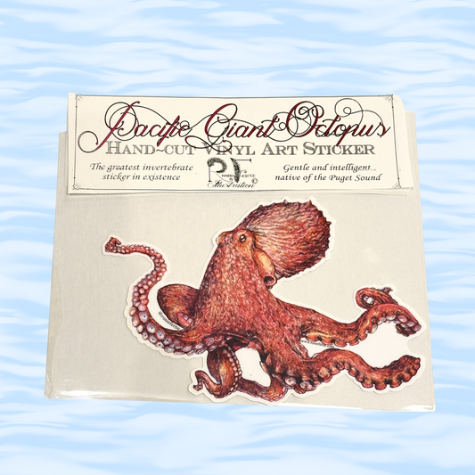 Hand-cut vinyl art sticker of a Pacific Giant Octopus on a beige background with ocean wave pattern.