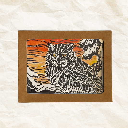 Card with an owl design in a brown box on a textured white background