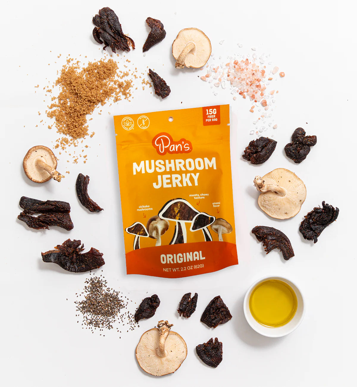 Packaged mushroom jerky with ingredients on a white background