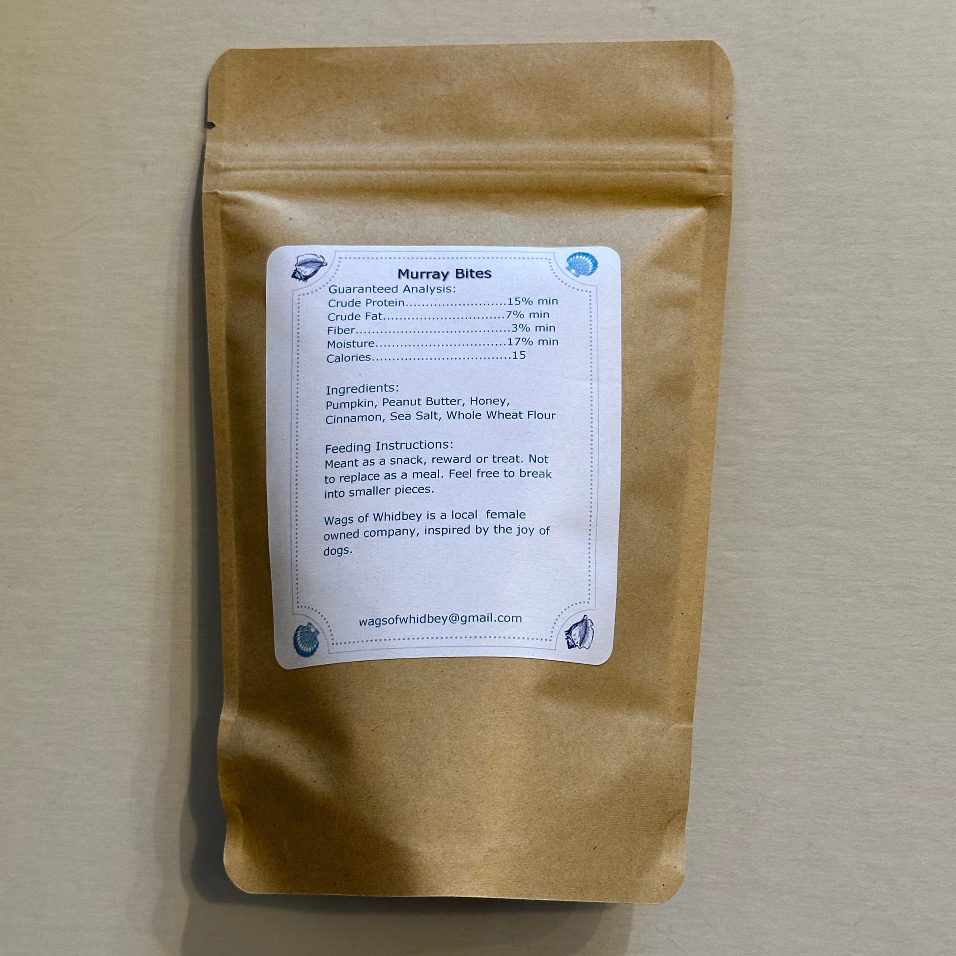 Brown paper package with a label on a beige background