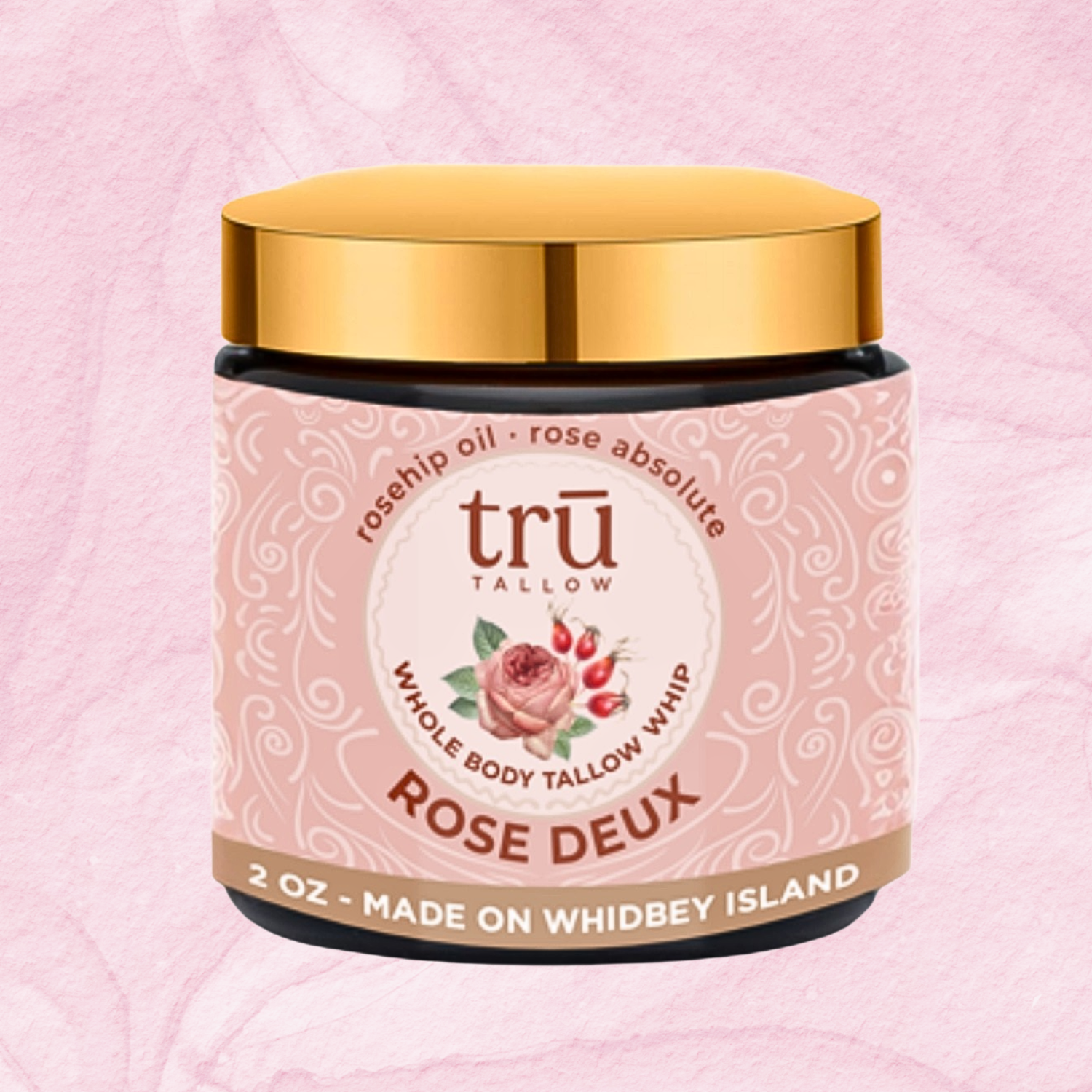 Tallow balm container labeled 'Rose Deux' on a pink background