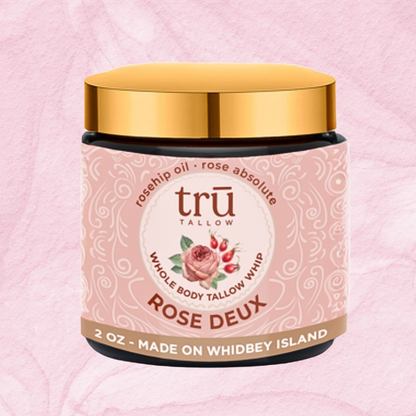 Tallow balm container labeled 'Rose Deux' on a pink background