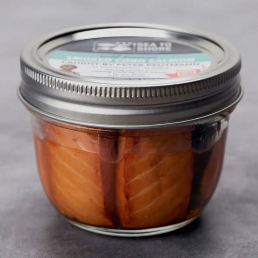 Jar of salmon on a gray background