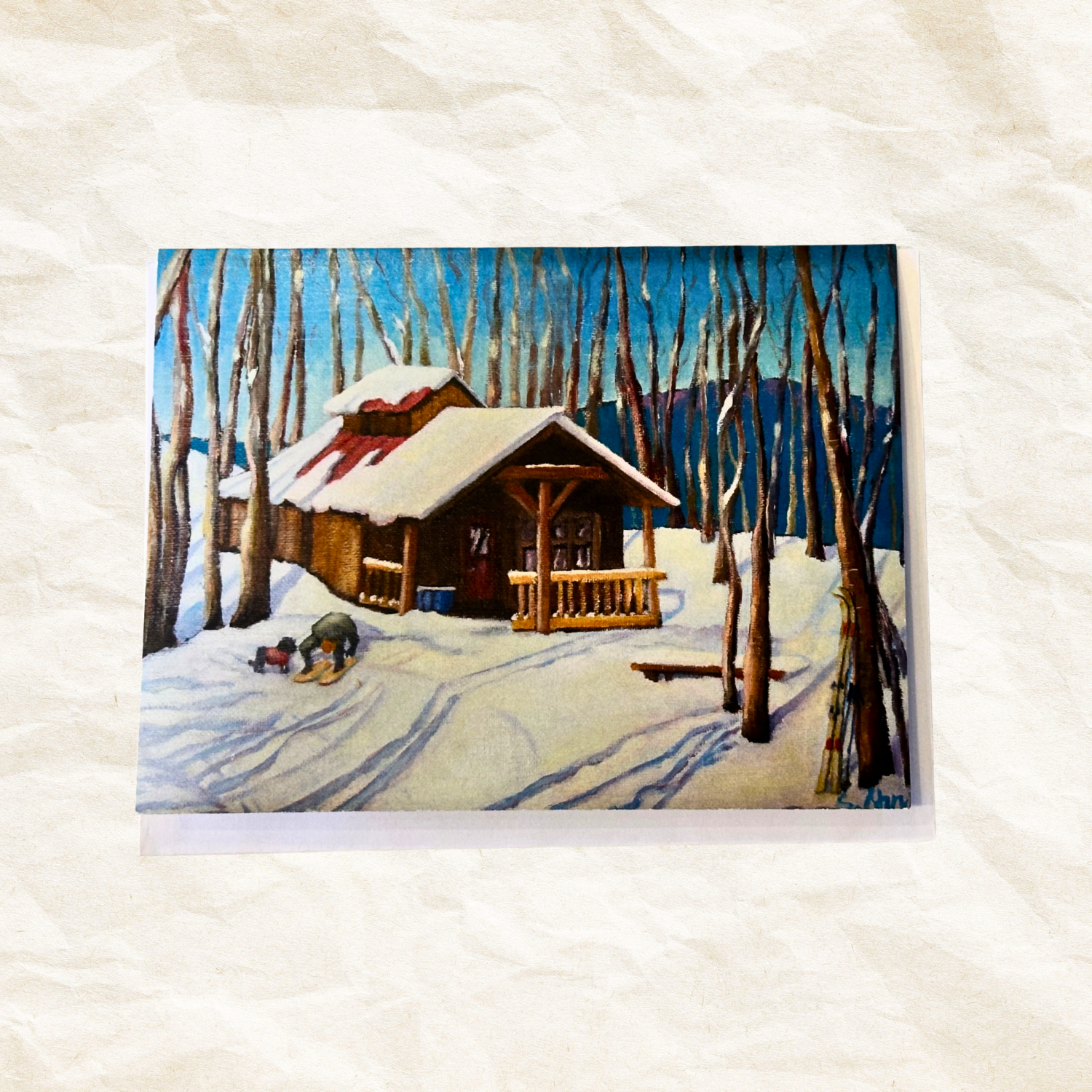 Winter scene with a cabin and trees on a textured white background