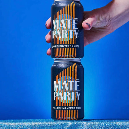Two cans stacked against a blue background