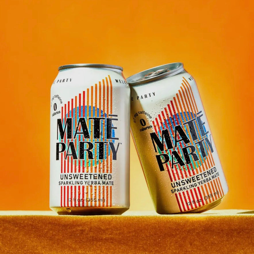 Two cans against an orange background