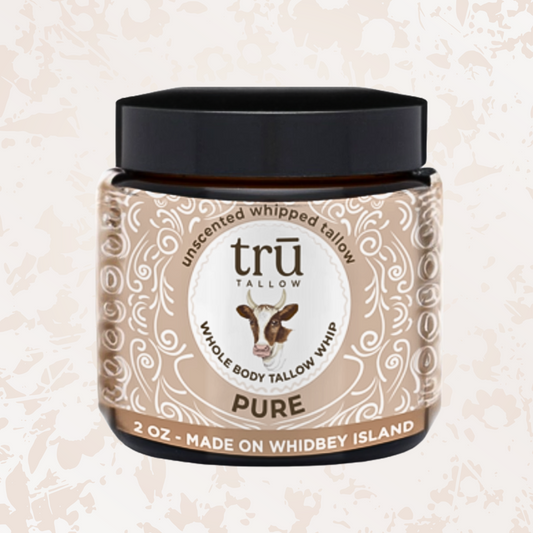 Jar of Tru Tallow on a beige background