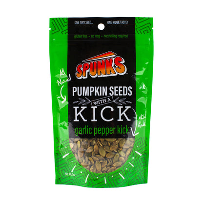 A green package of Spunk's Pumpkin Seeds with a Kick, indicating garlic pepper flavor, in a transparent window showing the seeds inside.