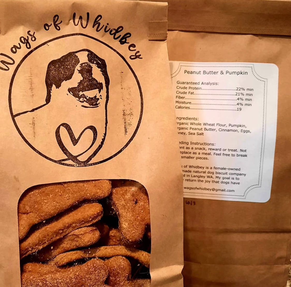 Wags of Whidbey dog treat bags, one facing front and one showing the label on the back.