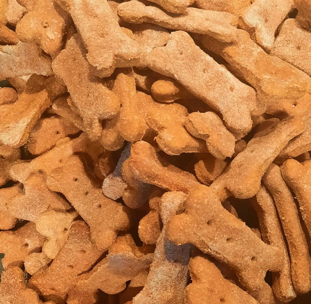 
                  
                    Pile of bone-shaped tan dog treats
                  
                